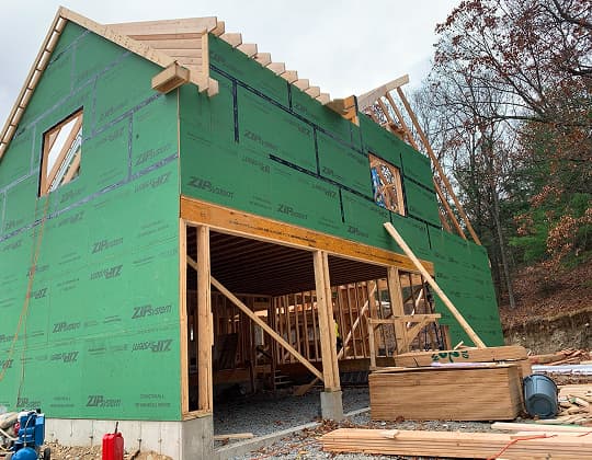 A rough framed home by a local construction company, covered in Zip System sheathing for weather protection.